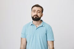 Portrait of a bearded guy looking unsatisfied and tired. Sometimes everyone have a bad day, so does this person. Man is royalty free stock photography Portrait of a bearded guy looking unsatisfied and tired. Sometimes everyone have a bad day, so does this person. Man is royalty free stock photography