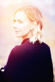 Beautiful blond woman standing outside and looking sad stock photos Beautiful blond woman standing outside and looking sad stock photos