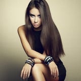 Portrait of beautiful brunette woman in black dress stock photo Portrait of beautiful brunette woman in black dress stock photo