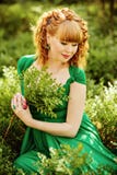 Portrait of a beautiful curly haired pregnant girl in a green dr royalty free stock photography Portrait of a beautiful curly haired pregnant girl in a green dr royalty free stock photography
