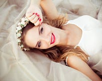 Portrait of a beautiful fashion bride, sweet and sensual. Wedding make up and hair. Flowers background. Art modern style. Blue eye royalty free stock photos Portrait of a beautiful fashion bride, sweet and sensual. Wedding make up and hair. Flowers background. Art modern style. Blue eye royalty free stock photos