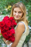 Portrait of a beautiful girl with a bouquet of roses in her hands royalty free stock image Portrait of a beautiful girl with a bouquet of roses in her hands royalty free stock image