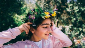 Portrait of a beautiful little girl wearing floral wreath royalty free stock photo Portrait of a beautiful little girl wearing floral wreath royalty free stock photo