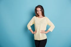 Portrait of a beautiful smiling girl isolated on blue background Stock Image Portrait of a beautiful smiling girl isolated on blue background Stock Image