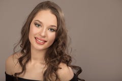 Portrait of a beautiful young brunette with long wavy hair stock photography Portrait of a beautiful young brunette with long wavy hair stock photography