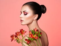 Portrait of beautiful young woman with Alstroemeria flowers royalty free stock photography Portrait of beautiful young woman with Alstroemeria flowers royalty free stock photography
