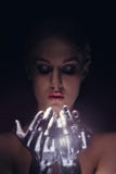 Portrait of beauty cyber woman from the future with clay hairstyle and silver hands Royalty Free Stock Photography Portrait of beauty cyber woman from the future with clay hairstyle and silver hands Royalty Free Stock Photography