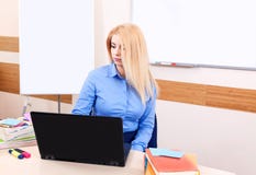 Portrait teacher woman femail classroom blue laptop notebook computer online internet young training school shirt informal stock photography Portrait teacher woman femail classroom blue laptop notebook computer online internet young training school shirt informal stock photography