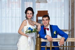 Portrait of the bride and groom at their wedding, indoors stock photography Portrait of the bride and groom at their wedding, indoors stock photography