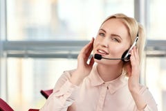 Portrait of businesswoman talking on the headset phone. stock image Portrait of businesswoman talking on the headset phone. stock image