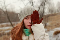 Portrait of a charming woman covering face with palm. stock photo Portrait of a charming woman covering face with palm. stock photo