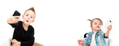Portrait of cheerful cute kids taking selfie on mobile phone stock images Portrait of cheerful cute kids taking selfie on mobile phone stock images