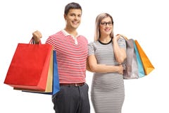 Portrait of a cheerful young couple posing with shopping bags stock images Portrait of a cheerful young couple posing with shopping bags stock images