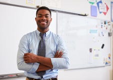 Portrait of confident African American male teacher in class stock photography Portrait of confident African American male teacher in class stock photography