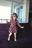 girl with funny glasses jumping dancing on couch indoors Royalty Free Stock Photo girl with funny glasses jumping dancing on couch indoors Royalty Free Stock Photo