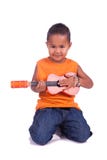A portrait of a cute asian boy with guitar Royalty Free Stock Images A portrait of a cute asian boy with guitar Royalty Free Stock Images