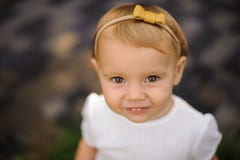 Portrait of a cute baby girl in a yellow bow royalty free stock photo Portrait of a cute baby girl in a yellow bow royalty free stock photo