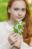 Portrait of a cute girl with long red hair in the park stock photos Portrait of a cute girl with long red hair in the park stock photos