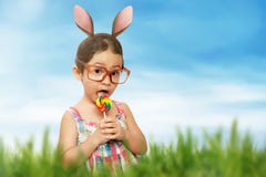 Portrait of a cute little girl dressed in easter bunny ears hold royalty free stock photography Portrait of a cute little girl dressed in easter bunny ears hold royalty free stock photography