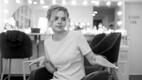 Portrait of cute young girl sit in armchair in makeup room, black and white royalty free stock photo Portrait of cute young girl sit in armchair in makeup room, black and white royalty free stock photo