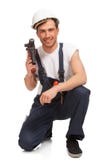 Portrait des glücklichen jungen Heimwerkers mit Hilfsmittel lizenzfreies stockbild Portrait des glücklichen jungen Heimwerkers mit Hilfsmittel lizenzfreies stockbild