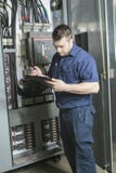 Portrait of an electrician in a room stock image Portrait of an electrician in a room stock image