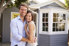 Portrait Of Excited Couple Standing Outside New Home royalty free stock photo Portrait Of Excited Couple Standing Outside New Home royalty free stock photo