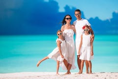 Happy beautiful family with kids on the beach stock photography Happy beautiful family with kids on the beach stock photography