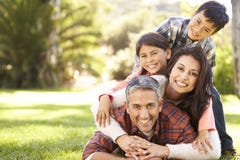 Portrait Of Family Lying On Grass In Countryside Royalty Free Stock Photography Portrait Of Family Lying On Grass In Countryside Royalty Free Stock Photography