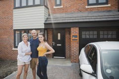 Family Portrait Outside of New Home Stock Photo Family Portrait Outside of New Home Stock Photo