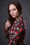 Portrait of a female in a colored dress on gray background royalty free stock images Portrait of a female in a colored dress on gray background royalty free stock images