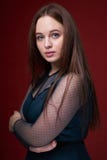 Portrait of a female in a colored dress on red background royalty free stock photography Portrait of a female in a colored dress on red background royalty free stock photography