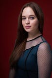 Portrait of a female in a colored dress on red background royalty free stock image Portrait of a female in a colored dress on red background royalty free stock image
