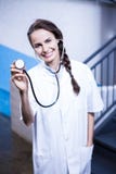 Portrait of female doctor showing stethoscope stock photo Portrait of female doctor showing stethoscope stock photo