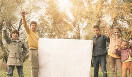 Portrait of four children in the park. Happy kids enjoying in a stock images Portrait of four children in the park. Happy kids enjoying in a stock images