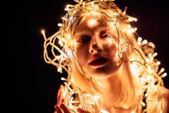 Portrait of a girl with a garland on black background stock images Portrait of a girl with a garland on black background stock images