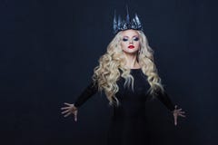 Portrait of a Gothic Princess. Beautiful young blonde woman in metal crown and black cloak. royalty free stock photo Portrait of a Gothic Princess. Beautiful young blonde woman in metal crown and black cloak. royalty free stock photo