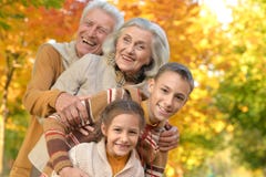 Portrait of grandparents with grandchildren in park royalty free stock images Portrait of grandparents with grandchildren in park royalty free stock images
