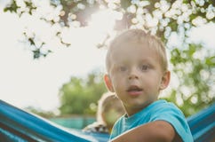 Baby boy playing in the garden. Happy little child. Stock Photo Baby boy playing in the garden. Happy little child. Stock Photo