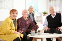 Portrait of happy elderly people at table stock photography Portrait of happy elderly people at table stock photography