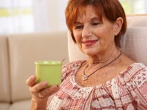 Portrait of elderly woman drinking coffee Stock Image Portrait of elderly woman drinking coffee Stock Image
