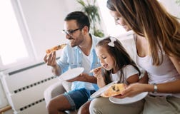 Portrait of happy family sharing pizza at home royalty free stock photography Portrait of happy family sharing pizza at home royalty free stock photography