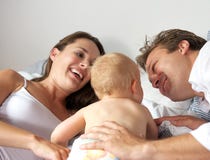 Portrait of a happy mother and father with baby Stock Image Portrait of a happy mother and father with baby Stock Image