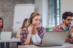 Portrait of happy smiling female customer support phone operator stock photo Portrait of happy smiling female customer support phone operator stock photo
