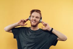 Portrait of Happy Smiling Guy Listening to Music Stock Images Portrait of Happy Smiling Guy Listening to Music Stock Images