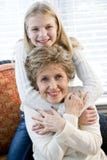 Portrait of happy young girl hugging grandmother Royalty Free Stock Images Portrait of happy young girl hugging grandmother Royalty Free Stock Images