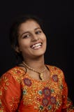 Portrait of a happy young Indian girl smiling on black background. royalty free stock image Portrait of a happy young Indian girl smiling on black background. royalty free stock image