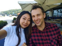 Portrait of a international couple in cafe smiling. royalty free stock photos Portrait of a international couple in cafe smiling. royalty free stock photos