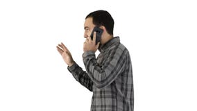 Portrait lat?ral d'un ?tudiant heureux marchant et parlant au t?l?phone portable sur le fond blanc photos libres de droits Portrait lat?ral d'un ?tudiant heureux marchant et parlant au t?l?phone portable sur le fond blanc photos libres de droits