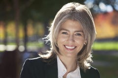 Portrait Of A Mature Businesswoman Smiling At The Camera Stock Image Portrait Of A Mature Businesswoman Smiling At The Camera Stock Image